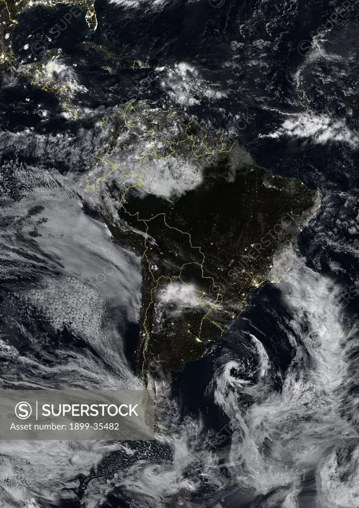 South America At Night With Borders And Cloud Coverage, True Colour Satellite Image. True colour satellite image of South America at night with borders and cloud coverage. This image in Lambert Azimuthal Equal Area projection was compiled from data acquired by LANDSAT 5 & 7 satellites.