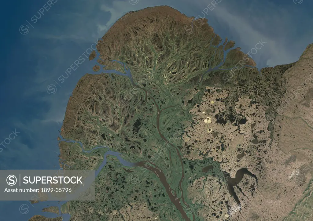Yukon River Delta, Alaska, Usa, True Colour Satellite Image. True colour satellite image of Yukon River Delta in Alaska, United States. The Yukon river empties into the Bering Sea at the Yukon-Kuskokwim Delta. Composite image using LANDSAT 7 data.