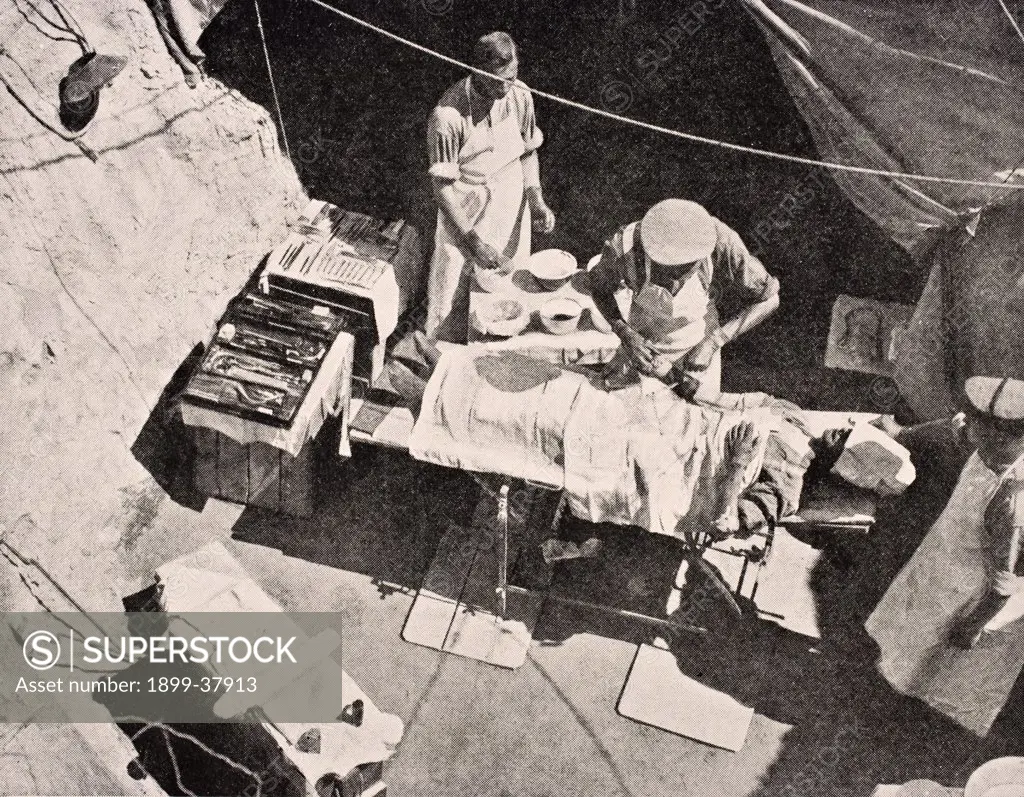 Field surgery on Gallipoli Peninsula Turkey 1915 Surgeon is removing bullet from arm of soldier From The War Illustrated Album deLuxe published London 1916