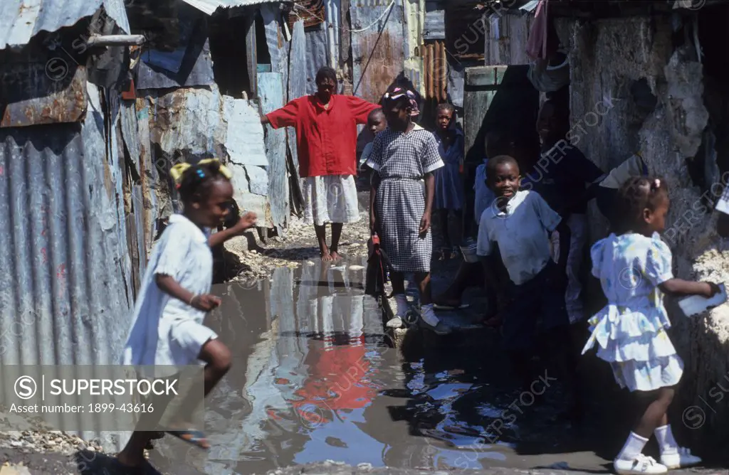 SLUMS, HAITI. Cite Soleil Shanty Town. Port-au-Prince. . As the top soil leaves the countryside so do the peasants. These environmental refugees are among the most disadvantaged people in the world. 