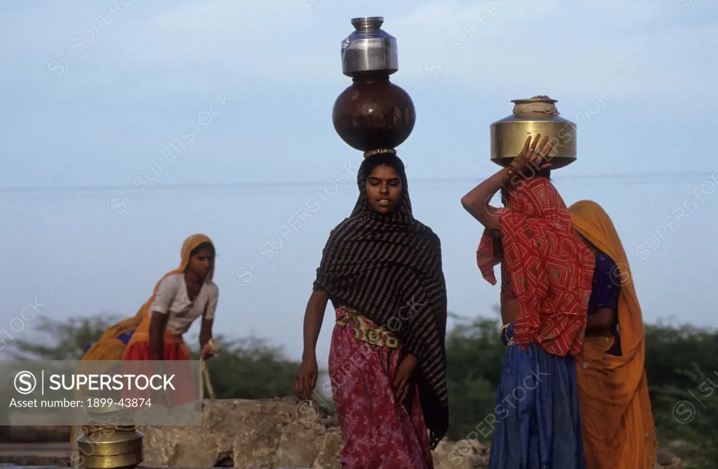 COLLECTING WATER - INDIA. Baaseli village, Rajasthan State. . 