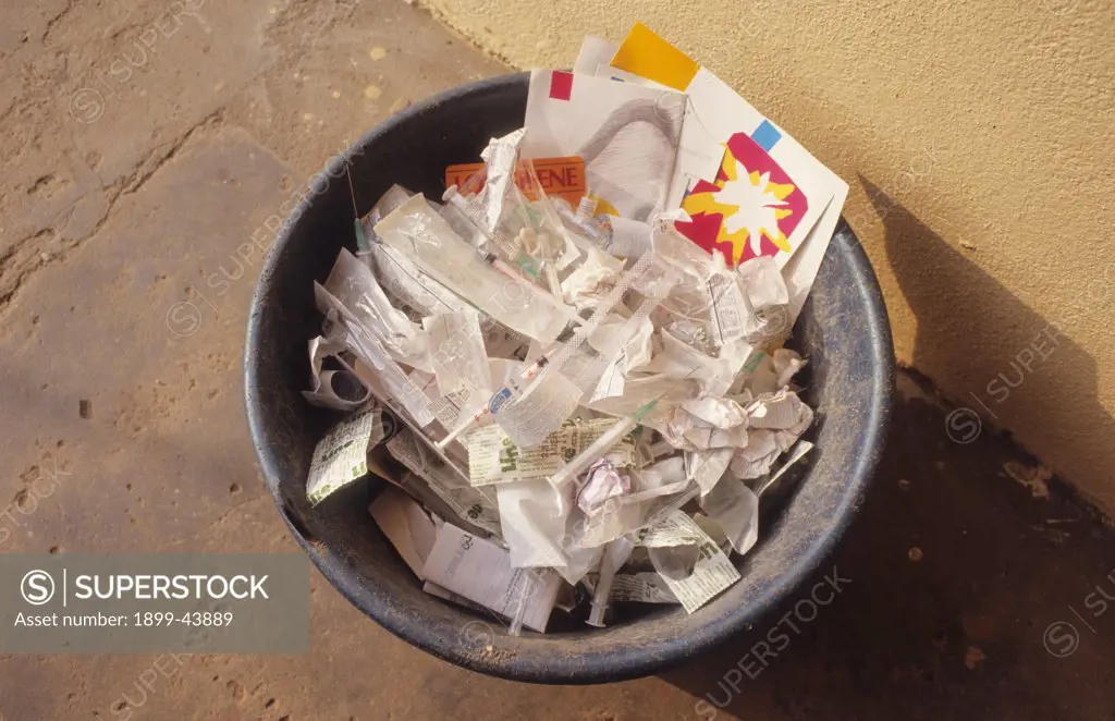 HOSPITAL WASTE, CAMEROON. Douala, Laquintinie hospital. Used syringes thrown away in a waste paper basket. . 