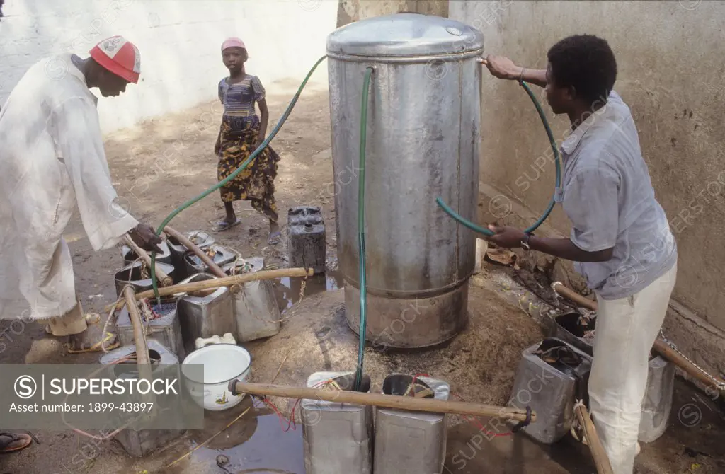 DOMESTIC WATER, CAMEROON. Maroua City. Collecting water from a municiple pump. . 