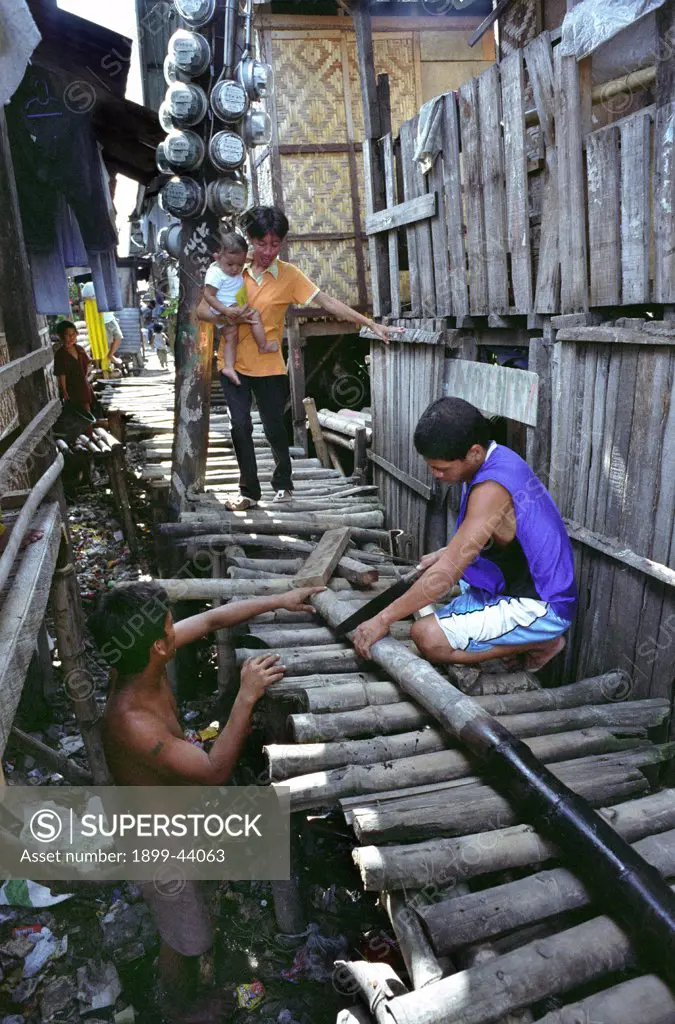 PHILIPPINES. Cebu City.These families are too poor to buy homes inland with access to clean water. . They are forced to build makeshift houses along estuaries which are flooded for six to eight months a year. There is no sanitation system and rubbish is dumped in the water. Many people in the community are affected by diarrhoea, tuberculosis and dengue fever. 