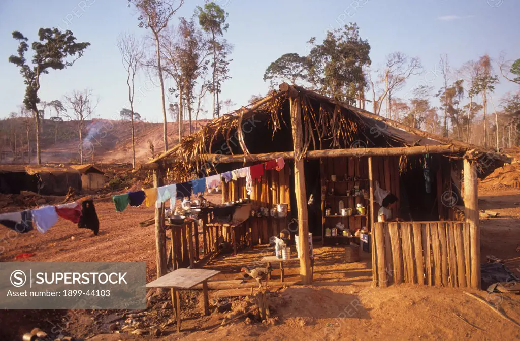 DESTRUCTION - AMAZON, BRAZIL. Bom Futuro, vicinity Ariquemes. . Miners live in dust covered polythene tents. 2500 garimpeiros (prospectors) mine tin ore here. 80 per cent have malaria and five men are shot each week. 