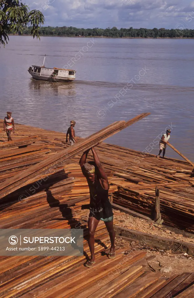 LOGGING, BRAZIL. Belem. Mahogany planks being loaded onto ships at Belem docks for export to Europe, Japan and America. . About 10% of the tropical harwood timber cut in Brazil is exported. The rest is used internally. 
