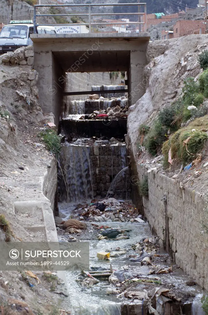 BOLIVIA - COCHABAMBA CITY. An open sewer-system on the outskirts of town. . 