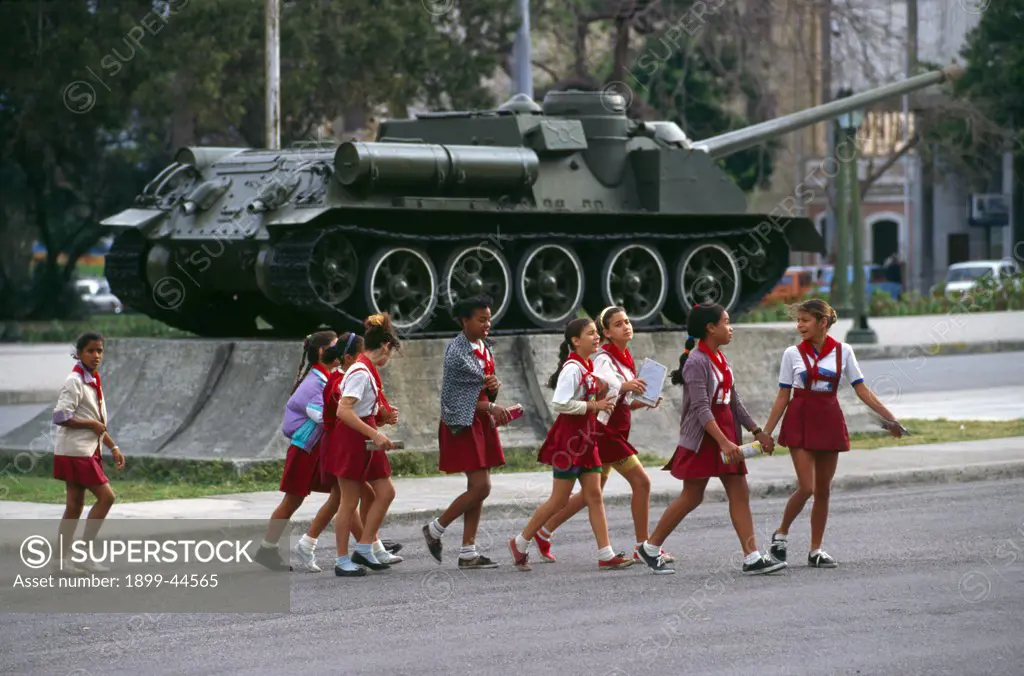 CUBA - Havana. Children in front of a military tank. . 