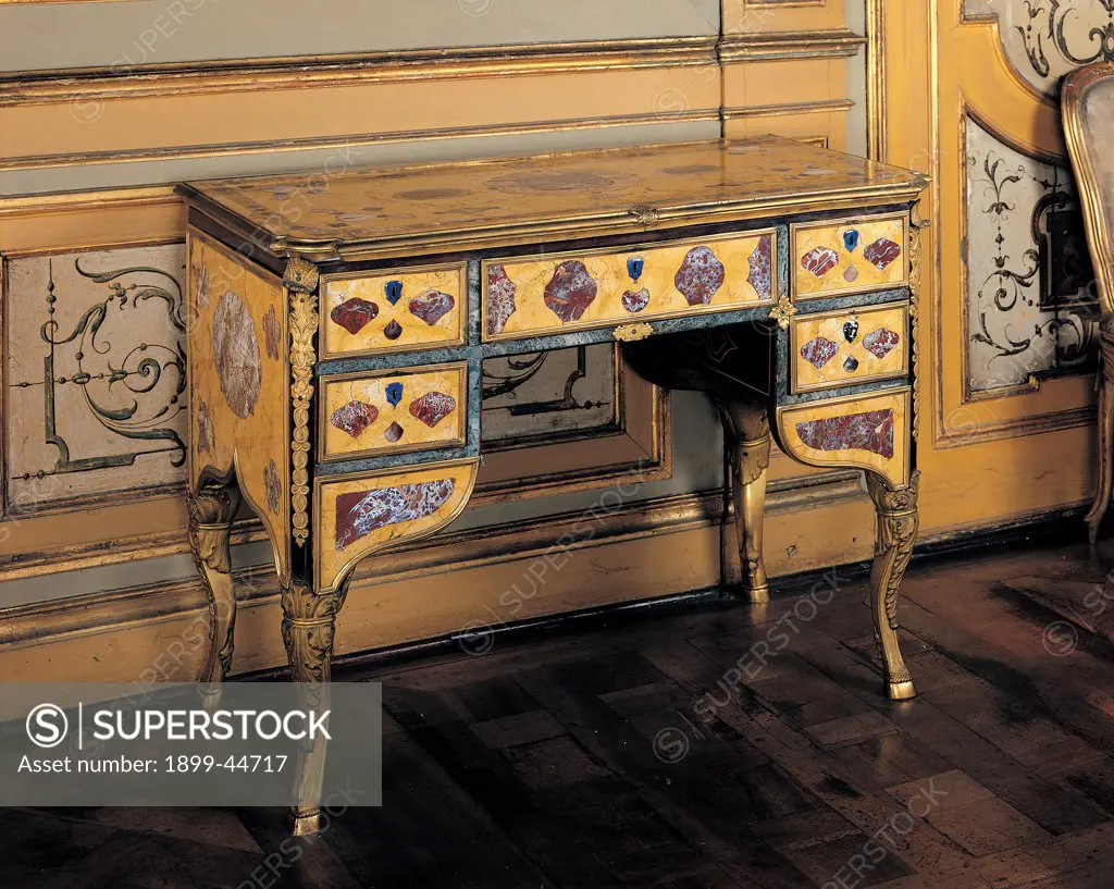 Writing desk, by Piedmont Work, 18th Century, inlaid marbles and gilded metal. Italy: Piemonte: Turin: Royal Palace. Whole artwork. Writing desk drawers top marbles volutes yellow