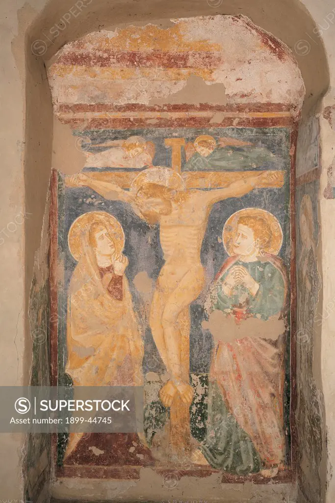Crucifixion, by Verona Artist, 13th Century, fresco. Italy: Veneto: Verona: Santo Stefano church. Whole artwork. Scene of crucifixion represented in a niche naked Christus patiens on the cross angels Madonna Mary St John the Evangelist