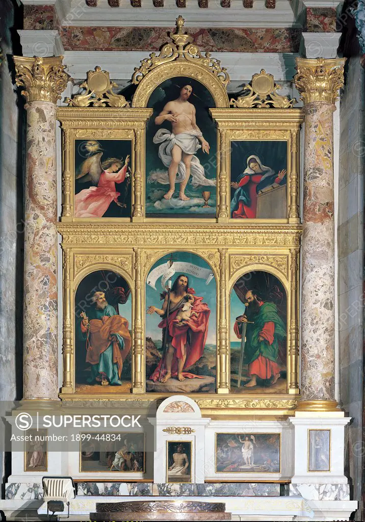 Polyptych. Annunciating Angel, Redeemer, Virgin Annunciate, St Peter, St John the Baptist and St Paul, by Lotto Lorenzo, 1525, 16th Century, oil on canvas and oil on panel. Italy. Lombardy. Bergamo. Ponteranica. Santi Vincenzo e Alessandro church. Christ with white drapery and goblet between pink angel with dove of the Holy-Spirit and Mary (Annunciation). Saints of St.Peter, old bearded with keys, book, brown mantle. St.John Baptist with pelts, cross, cartouche, lamb and view on the background. 