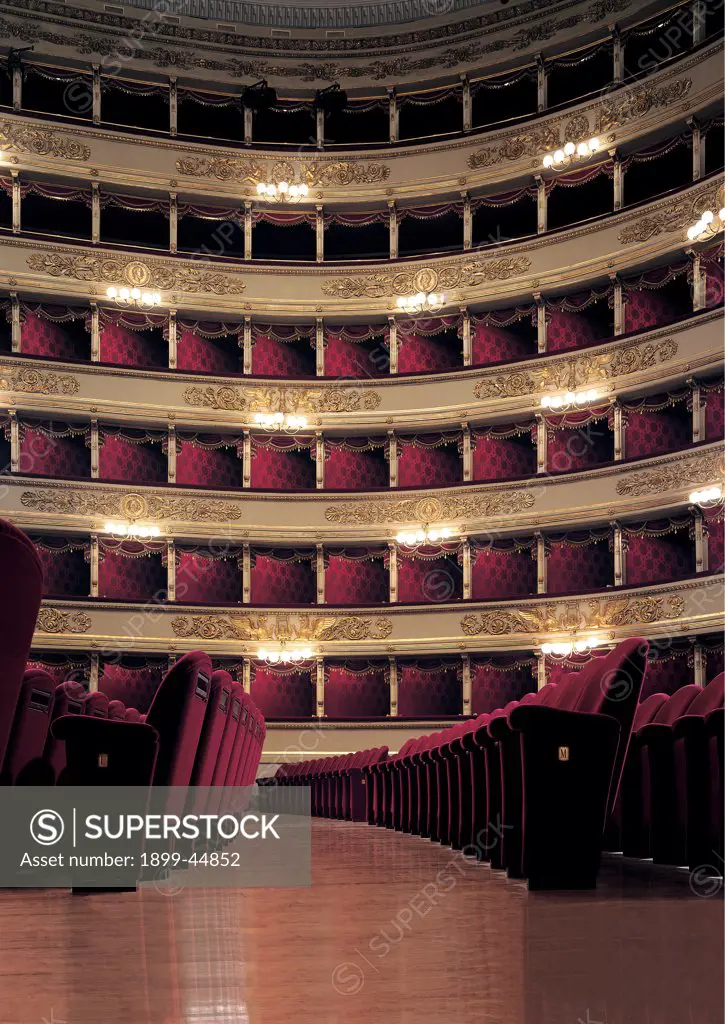 Views of the Teatro alla Scala, Milan, after its restoration in 2004, by Piermarini Giuseppe, 2004, 21st Century, . Italy: Lombardy: Milan: Teatro alla Scala. Detail. Gold concert hall boxes red seats floor