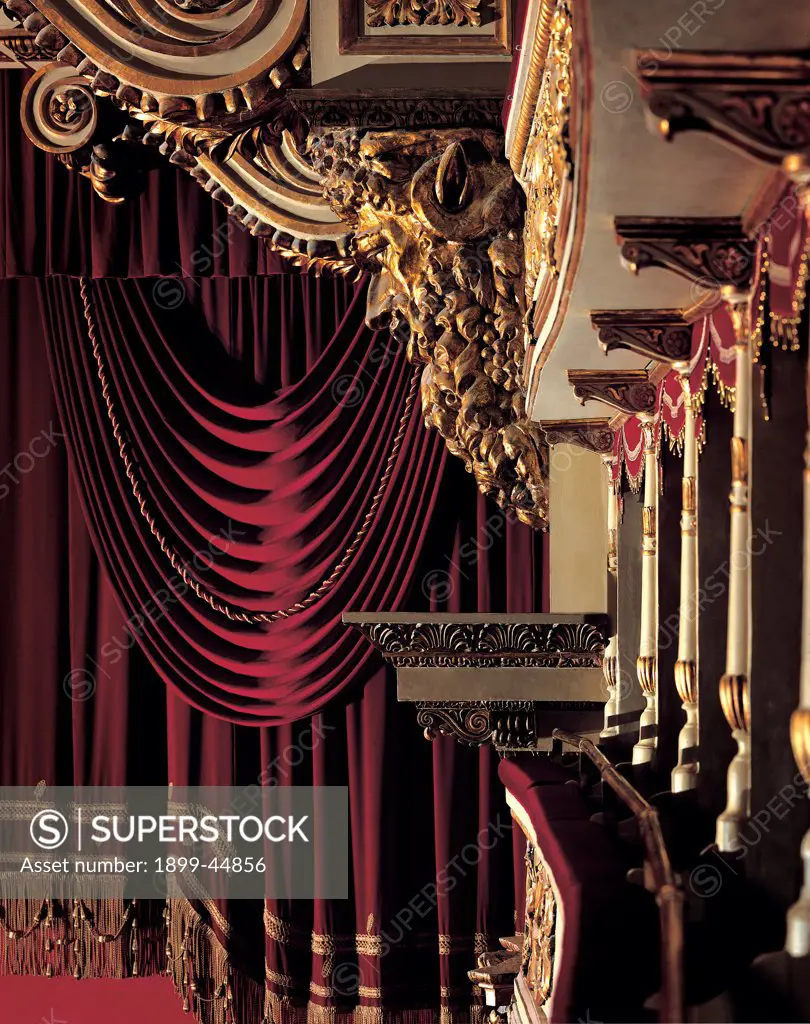 Views of the Teatro alla Scala, Milan, after its restoration in 2004, by Piermarini Giuseppe, 2004, 21st Century, . Italy: Lombardy: Milan: Teatro alla Scala. Detail. Proscenium gold frame/cornice boxes red decorative/ornamental array curtain