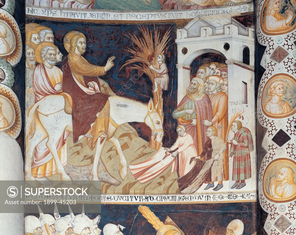 Stories from the Life of Christ, by Master of Sant'Abbondio, 1300 - 1325, 14th Century, fresco. Italy: Lombardy: Como: Sant'Abbondio Church. Panel Christ entering into Jerusalem frame donkey door town palm blessing gesture red mantle/cloak dress/garment yellow blue halo/aureole