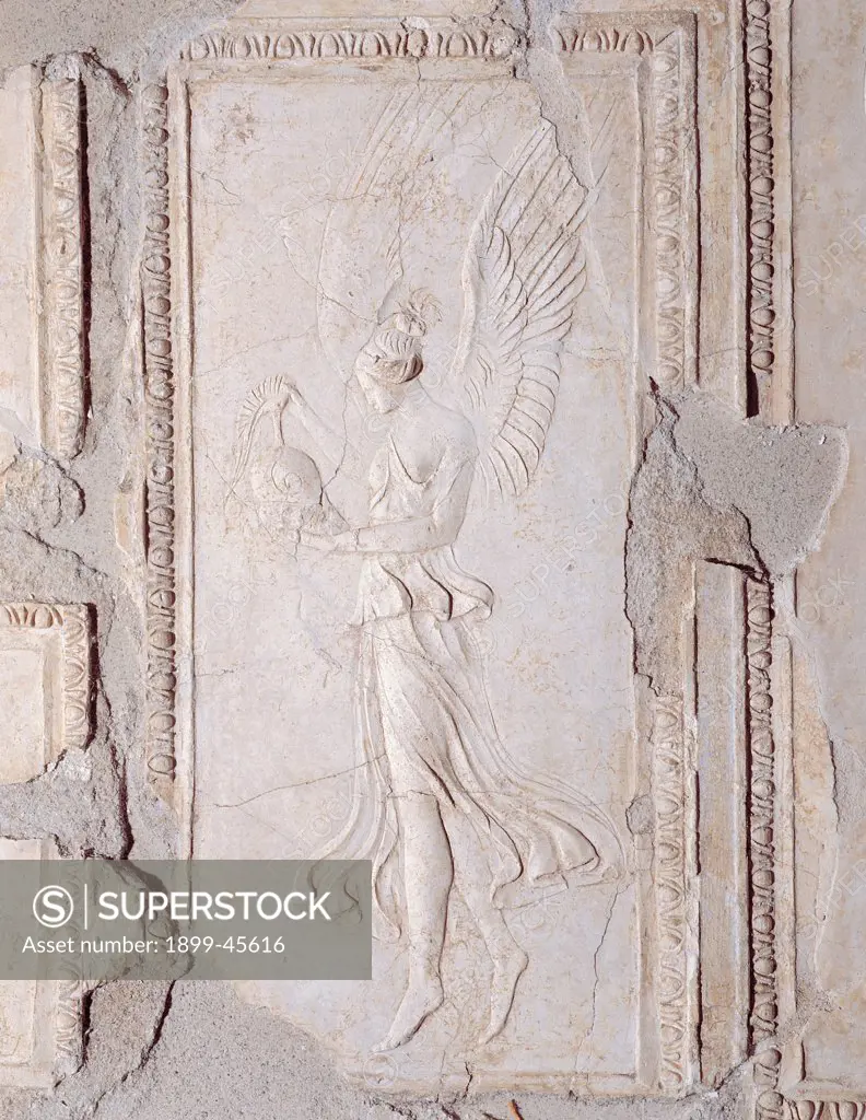 Winged Victory holding a crested helmet, by Unknown artist, 25,1st Century, stucco. Italy: Lazio: Rome: Palazzo Massimo alle Terme: volta del cubicolo E. Winged Victory holding a crested helmet wings Nike panel dress/clothes folds