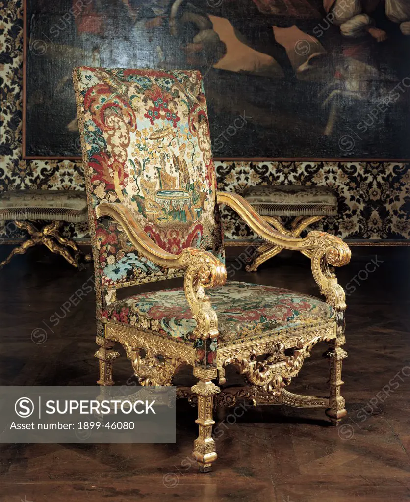 Armchair, by Piedmont Work, 18th Century, wood carved,gilded and partially painted, padded seat, back and sides covered with silk. Italy: Piemonte: Turin: Royal Palace: Madama Felicita Appartament. Whole artwork. Armchair chair padding/upholstery damask tissue/fabric colors gold gilt/gilding acanthus leaves decoration furniture furnishings interior/fittings design gold