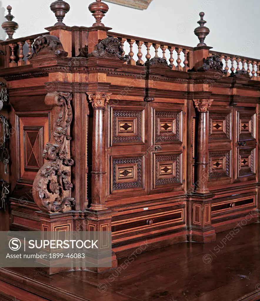 Cabinet, by Sicily workmanship, 18th Century, walnut wood carved and inlaid. Italy: Sicily: Palermo: Monreale: Santa Maria Nuova Cathedral: sagrestia. Detail. Cabinet furniture furnishings fittings design carvings decoration balustrade pinnacles drawers frames guilloches geometric inlays