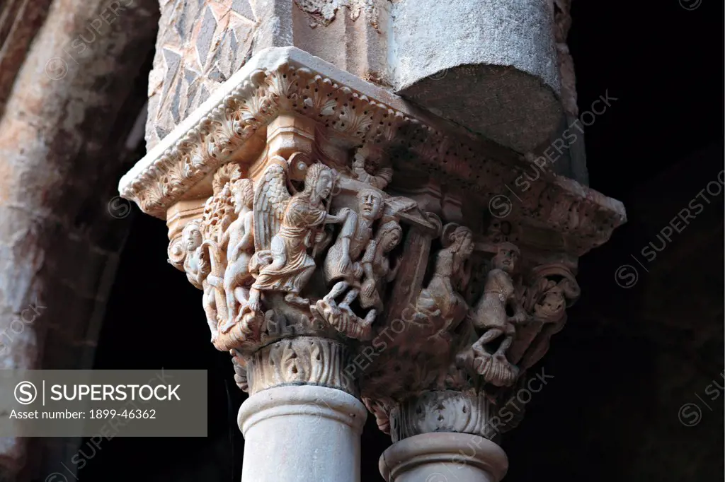 Monreale, Cathedral, by Unknown artist, 1172 - 1183, 12th Century, . Italy: Sicily: Palermo: Monreale: Santa Maria Nuova Cathedral. Detail. Exterior cloister paired columns carved capitals angel human figure leaves