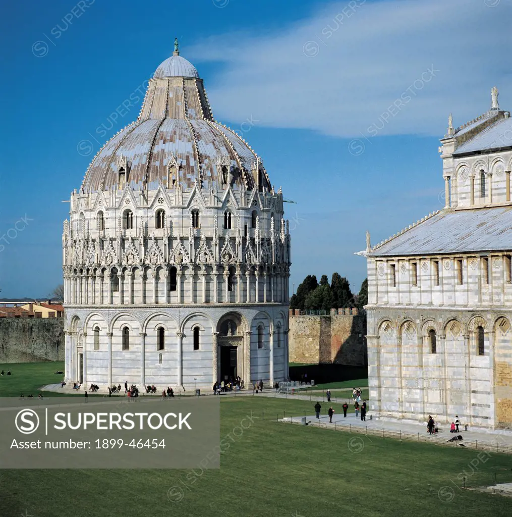 Baptistery of Pisa, by Diotisalvi, Nicola Pisano, 1152 - 1284, 12th Century, sandstone, marble. Italy: Tuscany: Pisa: Piazza dei Miracoli. Exterior baptistery ground floor blind arcading loggia small loggias open arches columns dome crown pinnacles/spires cusped tabernacles Rayonnant Gothic cusp