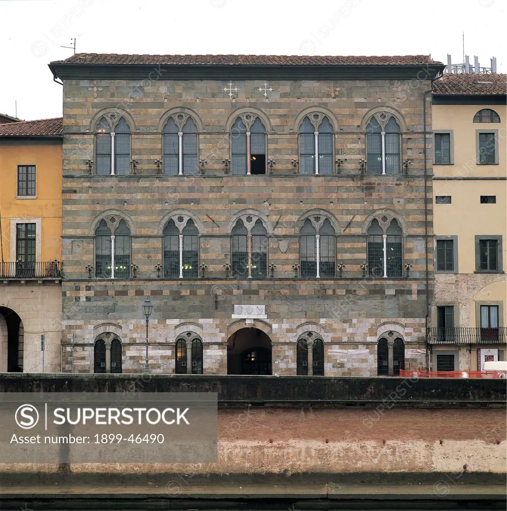 Palazzo Gambacorti, Pisa, by Unknown artist, 14th Century, Verrucano stone. Italy: Tuscany: Pisa: Palazzo Gambacorti. Whole artwork. Exterior facade palazzo stone quoins cornices doorway flattened arch windows pointed trilobate/trilobed two-light windows small columns round arches