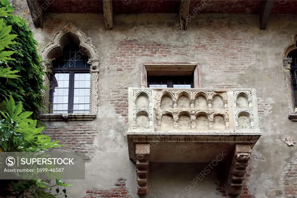 Juliet's House', balcony, by Unknown artist, 13th Century, bricks. Italy: Veneto: Verona: Juliet House. View Juliet's House balcony window wall exposed bricks trefoil windows balustrade
