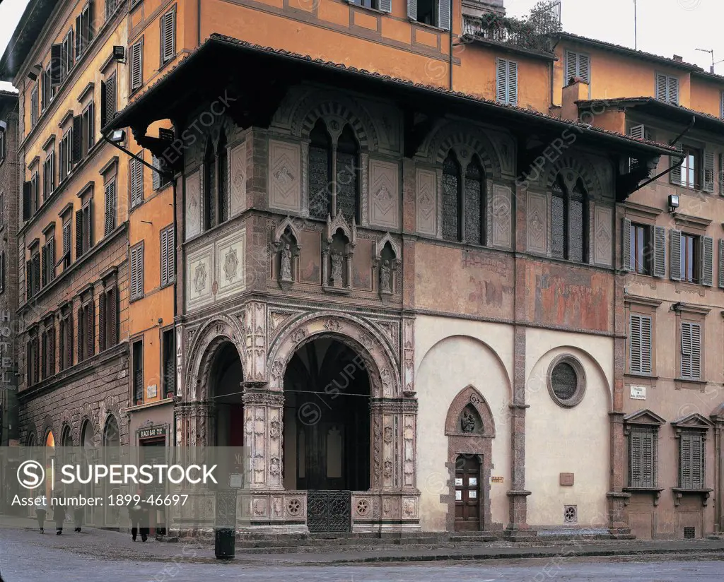Loggia del Bigallo - Florence, by Arnoldi Alberto, 1352 - 1358, 14th Century, . Italy: Tuscany: Florence: corner between Piazza San Giovanni and Via Calzaioli. Whole artwork. Loggia del Bigallo Florence wall roof street road junction arch windows building house