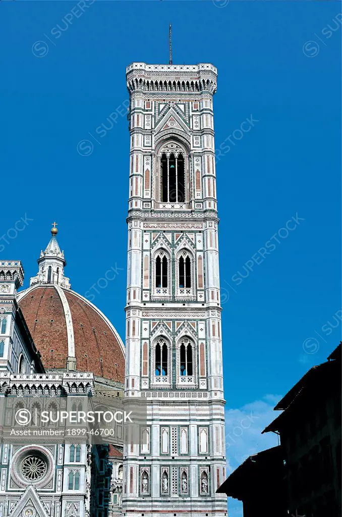 Bell tower of Santa Maria del Fiore, by Talenti Francesco, Andrea da Pontedera known as Andrea Pisano, Giotto, 1334 - 1360, 14th Century, polychrome marble. Italy: Tuscany: Florence: Santa Maria del Fiore Cathedral. View Giotto's Bell tower of Santa Maria del Fiore faced with Tuscan marble white sky light blue/azure