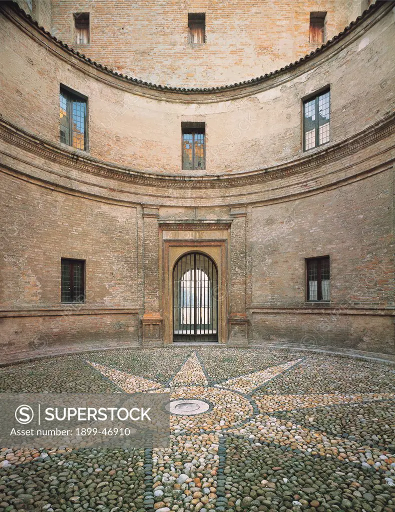 Mantegna's House on Via Acerbi, Mantua, by perhaps by Mantegna Andrea, 1476, 15th Century, . Italy: Lombardy: Mantua: Mantegna's House. Detail. Round courtyard Mantegna's house Mantua bricks cornice string-course paving pebbles star circle doorway