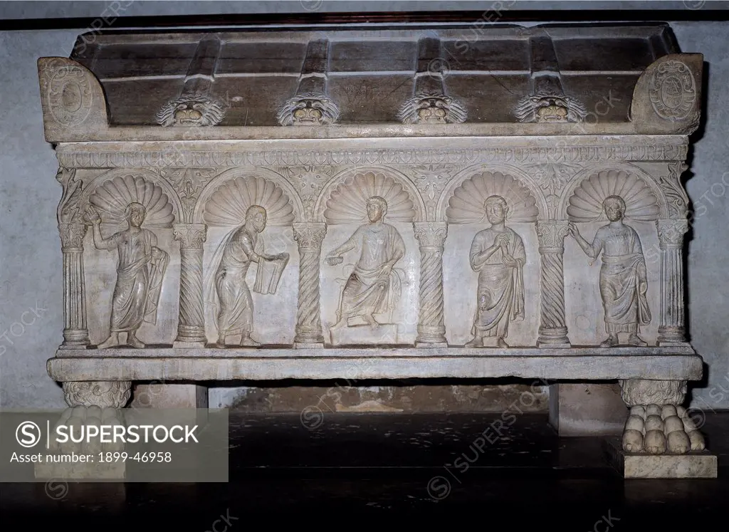Sarcophagus with Christ and Apostles, by Unknown artist, 4th Century, marble relief. Italy: Emilia Romagna: Ravenna: San Francesco Basilica. Whole artwork. Sarcophagus niches little spiral columns apostles lion's paws lion's head