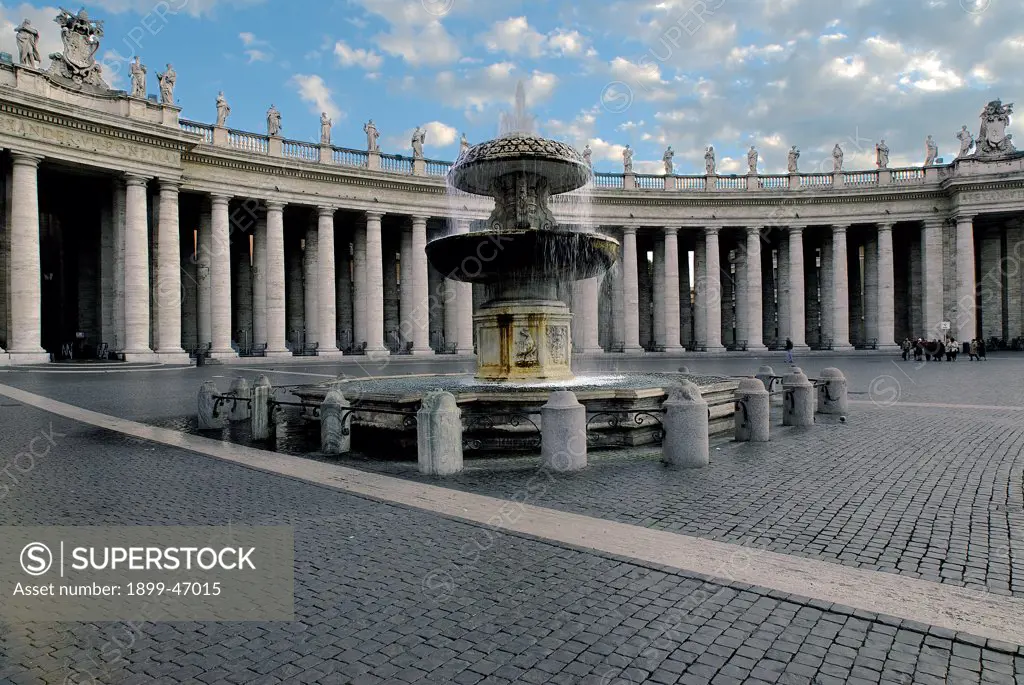 Fountain in Piazza San Pietro in the Vatican City, by Maderno Carlo, 1614 - 1615, 17th Century, marble. Italy: Lazio: Rome: Vatican City. View fountain quatrefoil basin sculpted base with varying lines of projection top bowl mushroom-shaped Vatican City colonnade