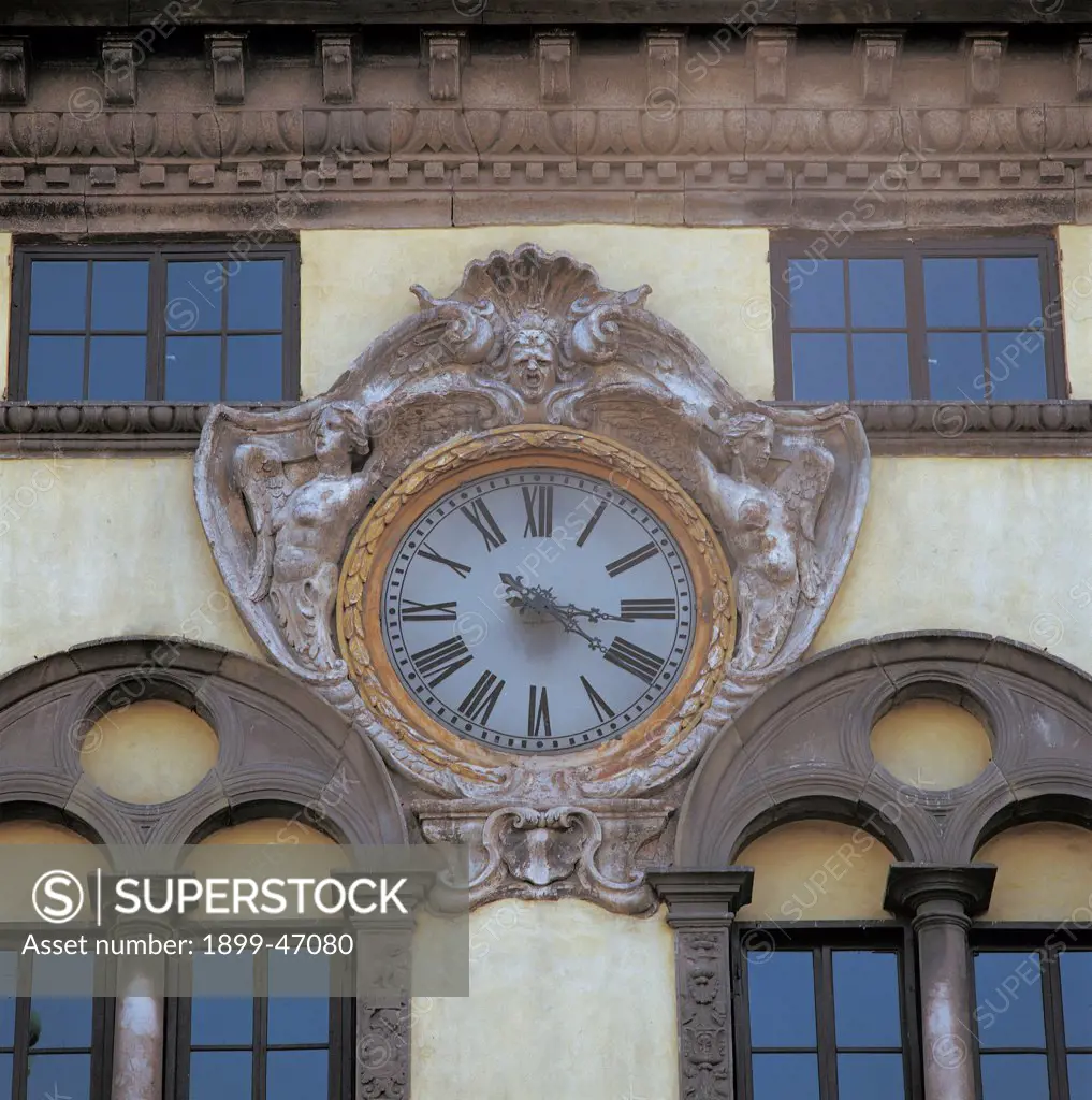 Palazzo Pretorio, by Civitali Nicolao, Civitali Matteo, 1494, 15th Century, . Italy: Tuscany: Lucca: Palazzo Pretorio. Detail. Clock winged victories cornice