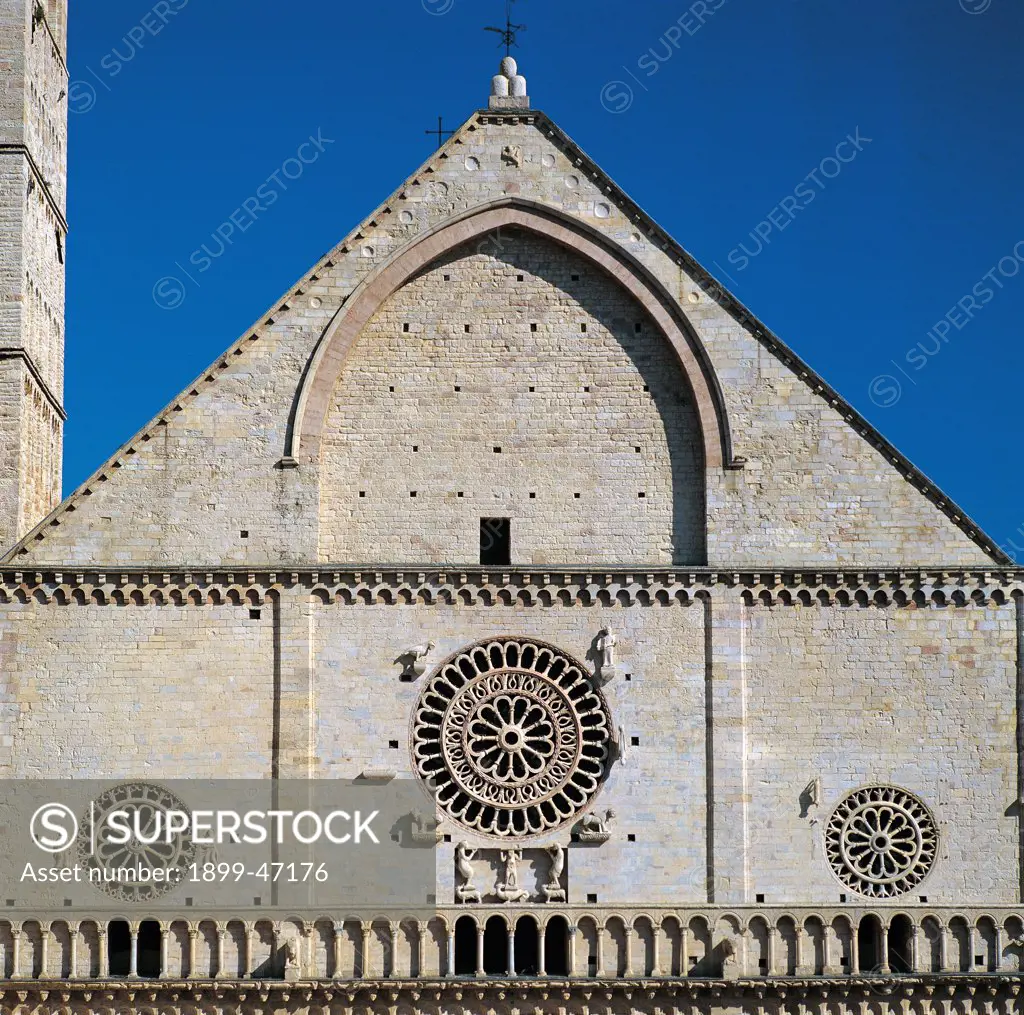 Cathedral of San Rufino, by Alessi Galeazzo, Giovanni da Gubbio, 1140, 12th Century, . Italy: Umbria: Perugia: San Rufino cathedral. Detail. Top gable facade church cathedral San Rufino Assisi stone cornice fake gallery with blind arcading rose window pointed blind arch