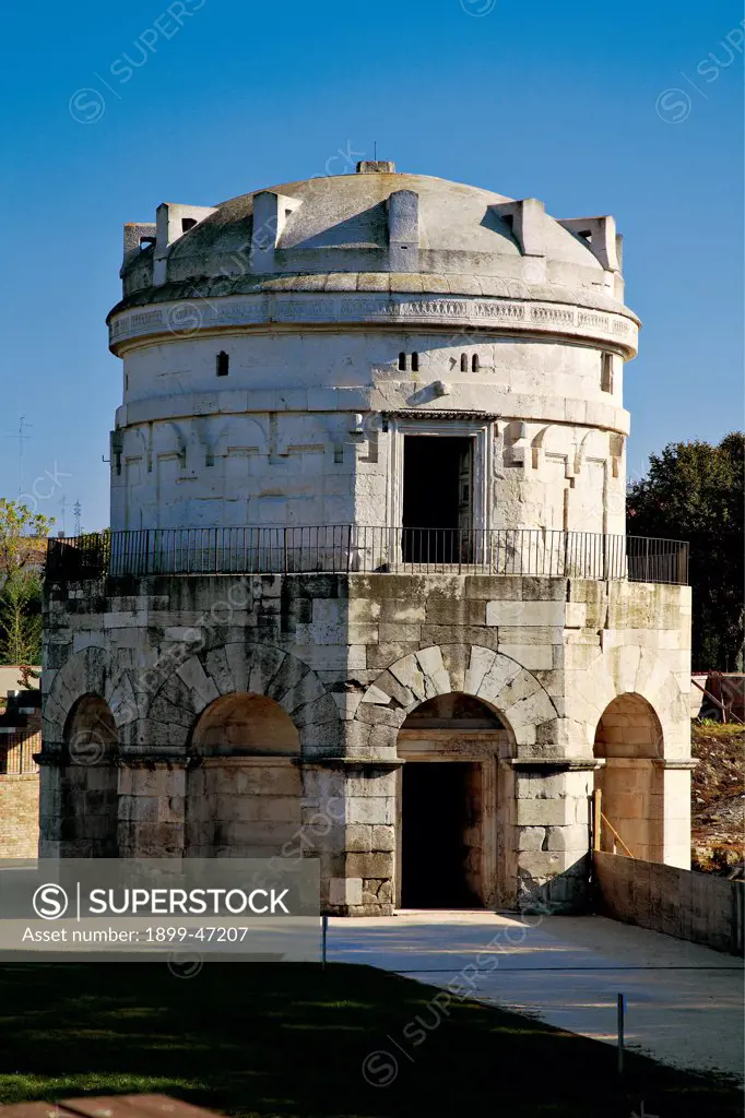 Mausoleum of Theodoric in Ravenna, by Unknown artist, 520, 6th Century, Istrian stone. Italy: Emilia Romagna: Ravenna: Theodoric Mausoleum. Whole artwork. Exterior tomb mausoleum of Theodoric ashlars/quoins white stone gray central decagonal circular plan double tier/order blind round arches second tier entrance pincer-shaped cornice monolithic lowered dome