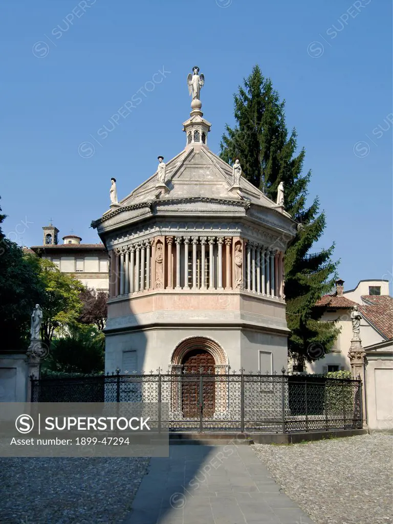 Baptistery, by Giovanni da Campione, 1340, . Italy: Lombardy: Bergamo: Baptistery. Front view baptistery octagonal plan Bergamo small columns statues angel round arch doorway