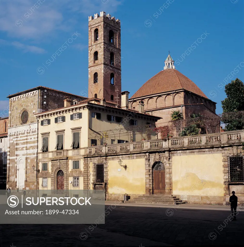 Baptistery and Church of Santi Giovanni e Reparata, by Unknown artist, 6th Century, . Italy: Tuscany: Lucca: Santi Giovanni e Reparata Church and Baptistery. View. Square bell-tower battlements/crenellation/merlons dome baptistery transept side marble white stone two-color buildings