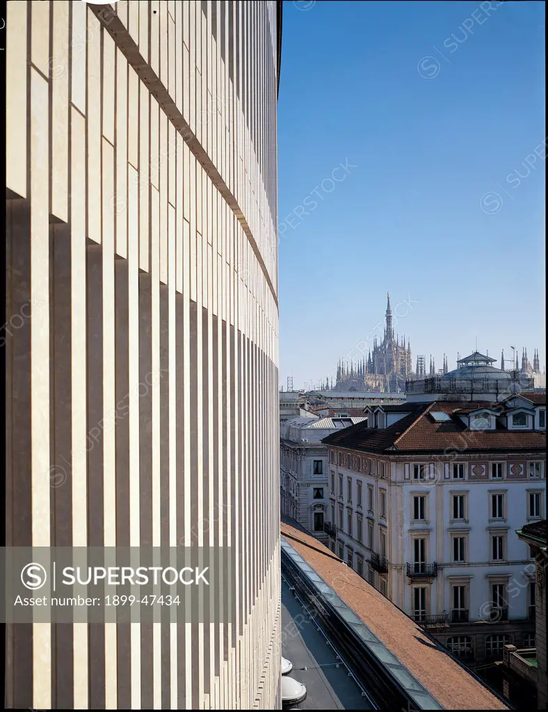 View of La Scala Theater after restoration in 2004, by Botta Mario, 2004, 21st Century, Unknow. Italy, Lombardy, Milan, La Scala Theater. La Scala Theater Milan detail ellipsis stone facing view of city houses Duomo Milan cathedral.