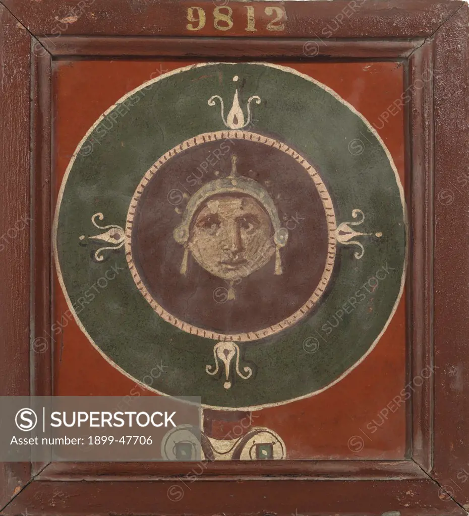 Medallion with female mask, by Unknown, 1st Century, painted stucco. Italy, Campania, Naples, National Archaeological Museum, from Herculaneum. Whole artwork. Mask face green red medallion tondo.