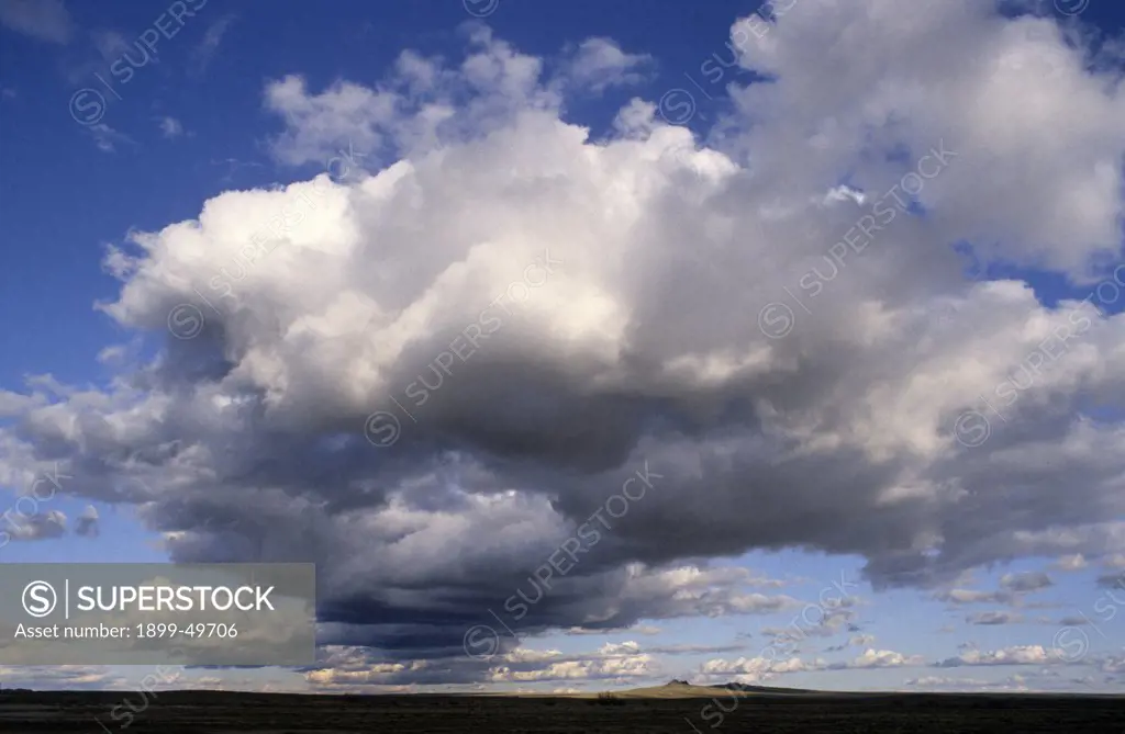 Cumulus congestus clouds over the Great Basin Desert.    Navajo reservation, northeastern Arizona, USA.