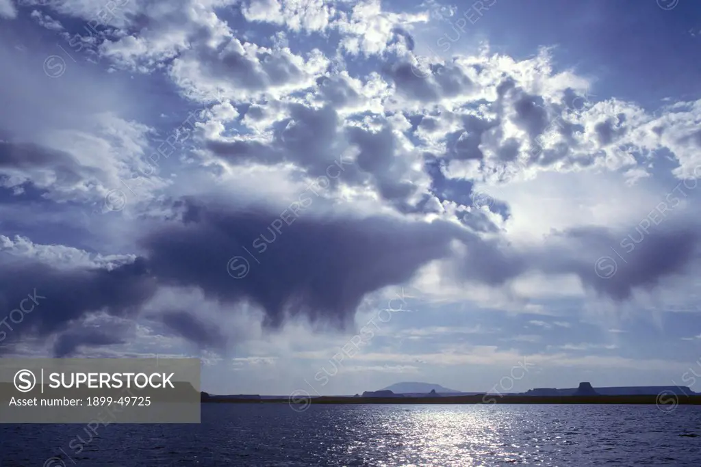 Altocumulus clouds with virga (precipitation which evaporates before reaching earth) over Lake Powell.   Northern Arizona, USA.