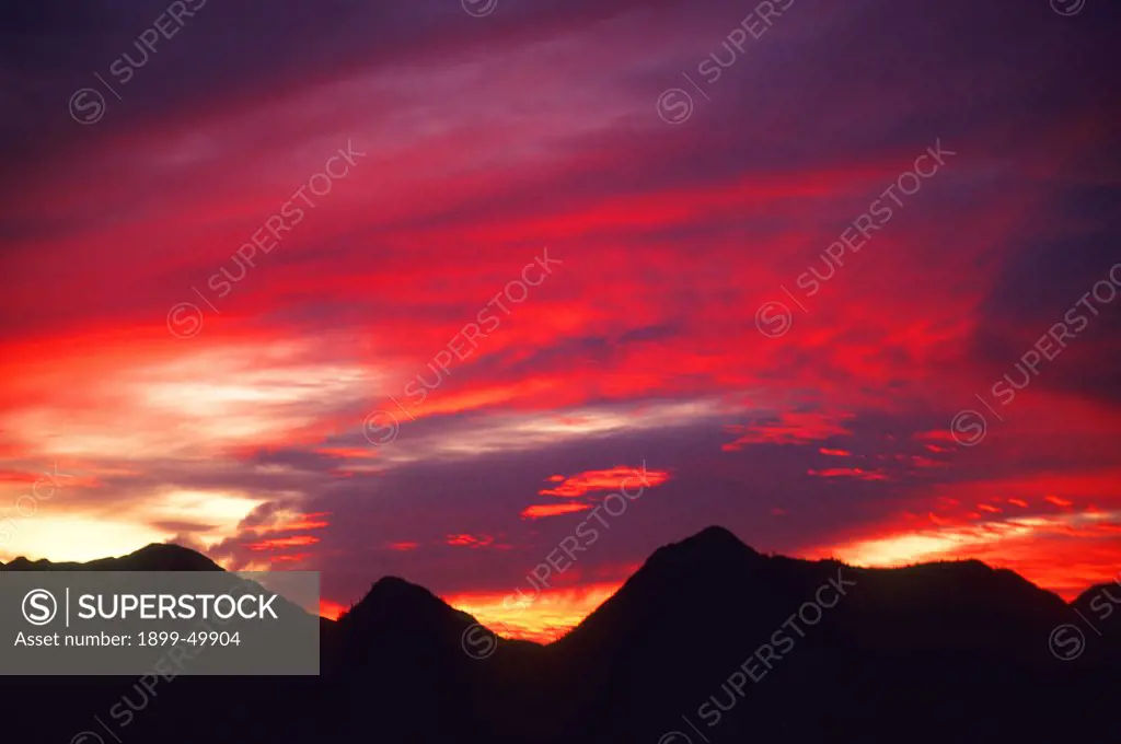 Arizona sunset with altostratus clouds over Tucson Mountains. Sonoran Desert. Saguaro National Park, Tucson, Arizona, USA.