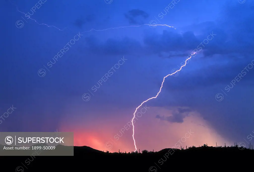Flash of cloud-to-ground lightning at sunset.  Tucson, Arizona, USA.