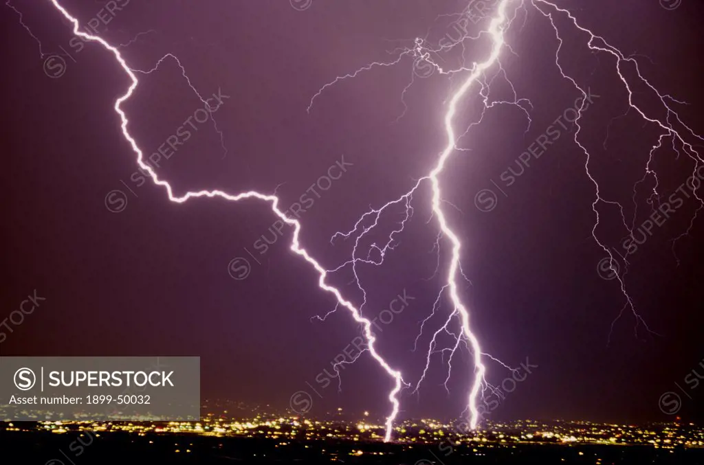 Two intense cloud-to-ground lightning strikes, one of which is an excellent example of zigzag lightning.   Tucson, Arizona, USA.