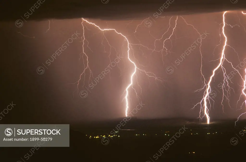 Two cloud-to-ground lightning discharges.  West-central New Mexico, USA.