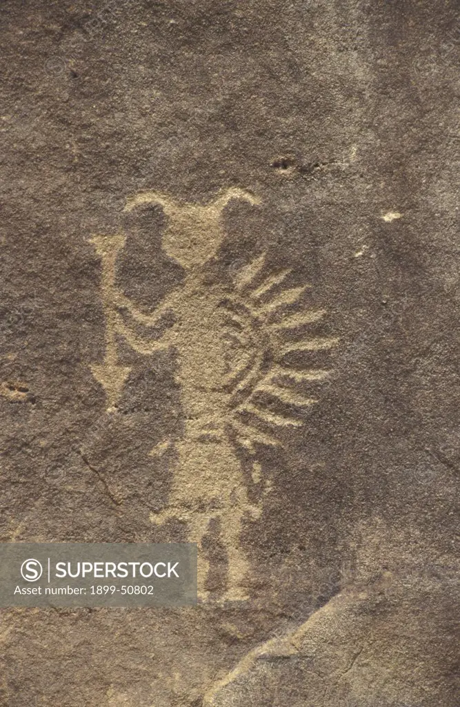 New Mexico. Largo Canyon. Petroglyphs. Man Holding Shield And Arrow.