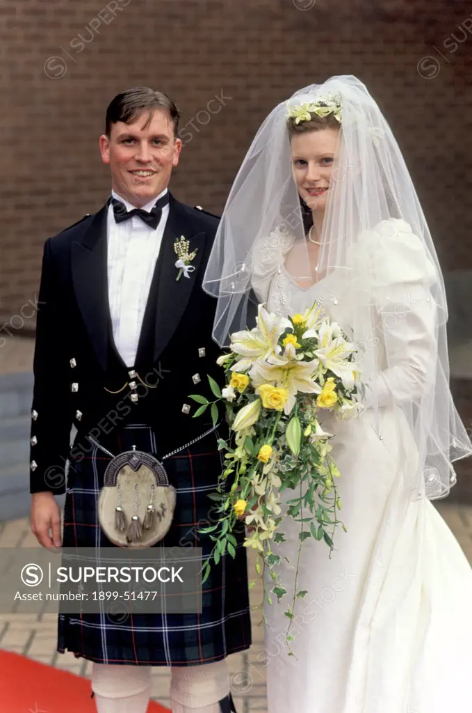 Scotland, Glasgow. Couple In Traditional Wedding Dress