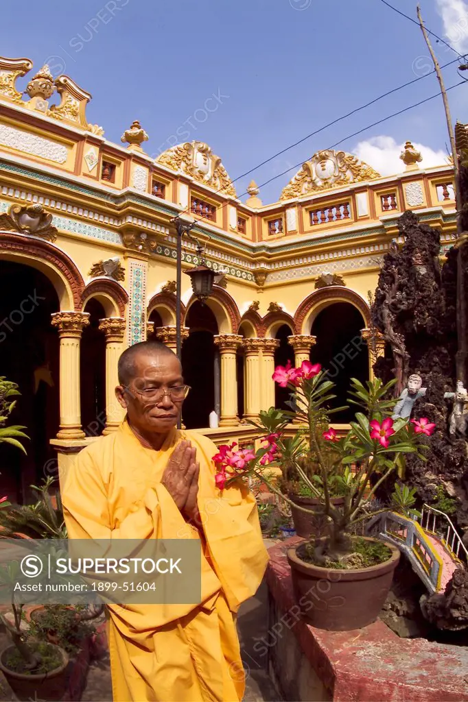 Vietnam, My Tho City. Vinh Trang Pagoda. Monk