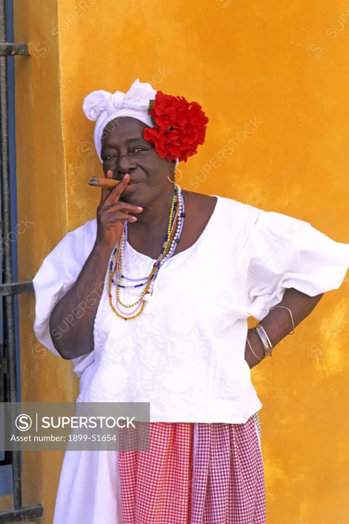 Cuba, Havana. Portrait Of A Cuban Woman Smoking A Cigar