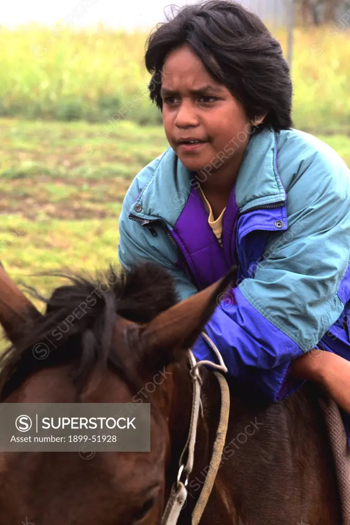 Easter Island. Boy On Horseback During Tapati Festival Rapa Nui