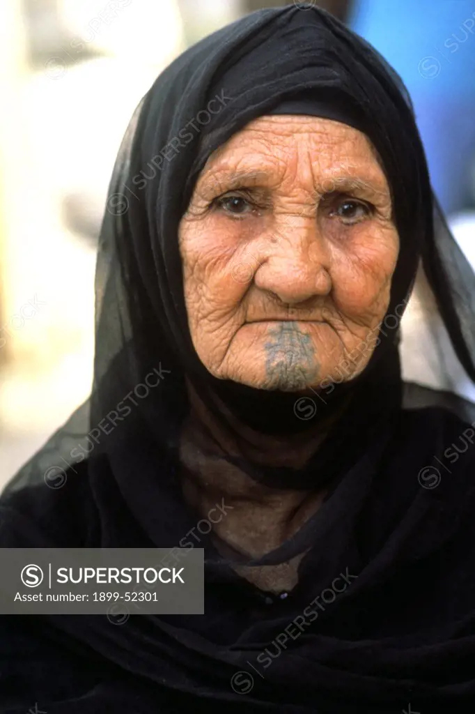 Egypt, Cairo. Egyptian Woman. Tattooed And Wearing Traditional Dress