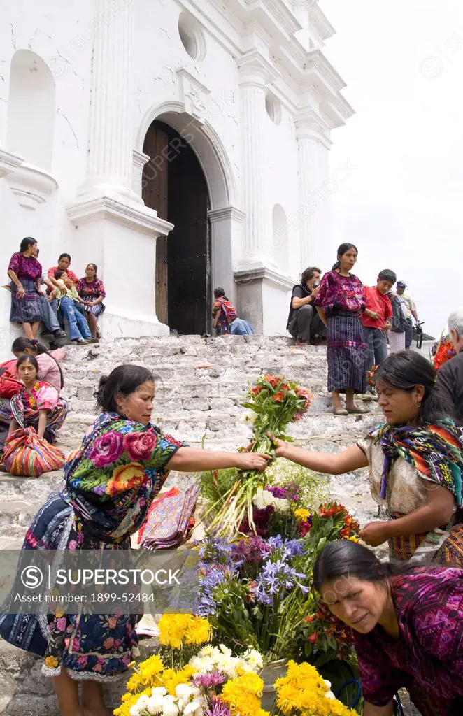 Woman Selling Flowers On Steps Of Old Cathedral In Chichicastenango, Guatemala